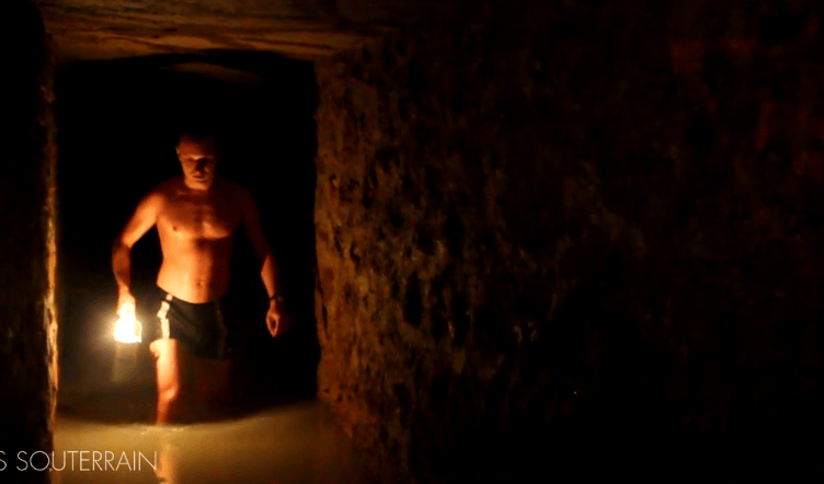 American Woman In Bikini Desecrates French Catacombs For Her “Female Indiana Jones” Brand